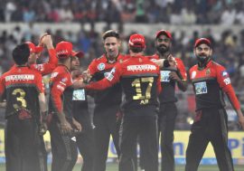 Kolkata: Royal Challengers Bangalore players celebrate fall of a wicket during an IPL 2018 match between Kolkata Knight Riders and Royal Challengers Bangalore at the Eden Gardens in Kolkata