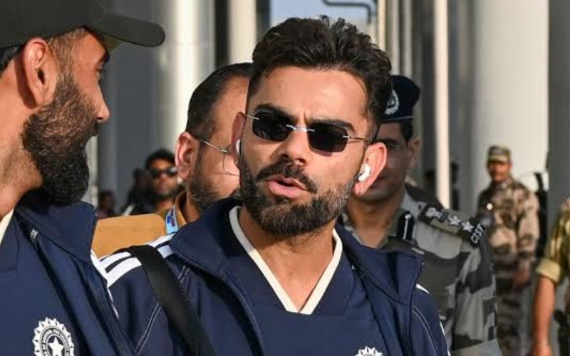 virat kohli walking at the airport